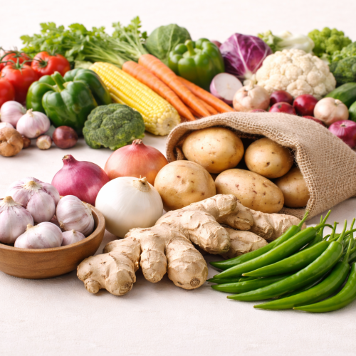 Fresh vegetables on a beige surface